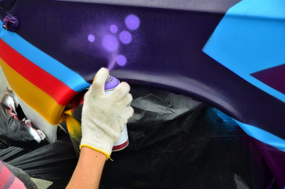 a-hand-with-a-spray-can-that-draws-a-new-colorful-2025-03-16-23-37-16-utc.jpg